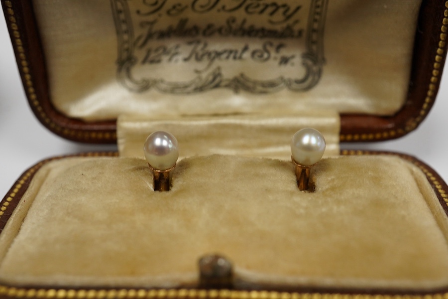 A group of gentleman's accessories, early 20th century, comprising: two pairs of cultured pearl collar studs, one set marked 15CT, each with fitted cases; a stick pin topped with the head of a fox, indistinct mark to pin